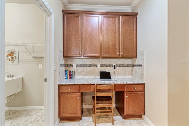 19418 Butterwood Ln, Lutz, FL 33558 - home office with built in desk, light tile patterned flooring, ornamental molding, and baseboards