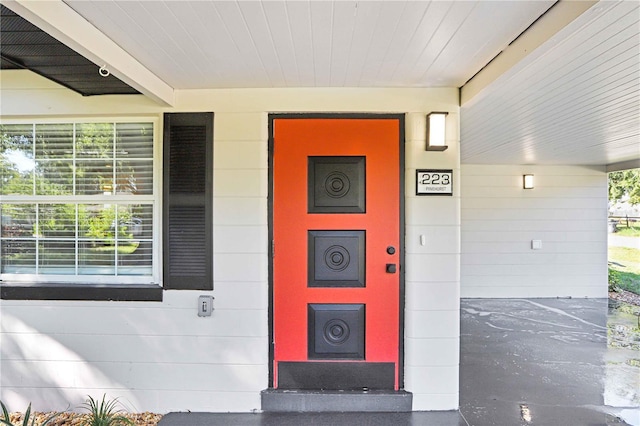 223 Pinehurst Dr, Auburndale, FL 33823 - view of exterior entry featuring a porch