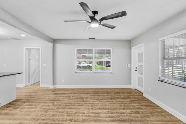 223 Pinehurst Dr, Auburndale, FL 33823 - empty room with light wood-type flooring and ceiling fan