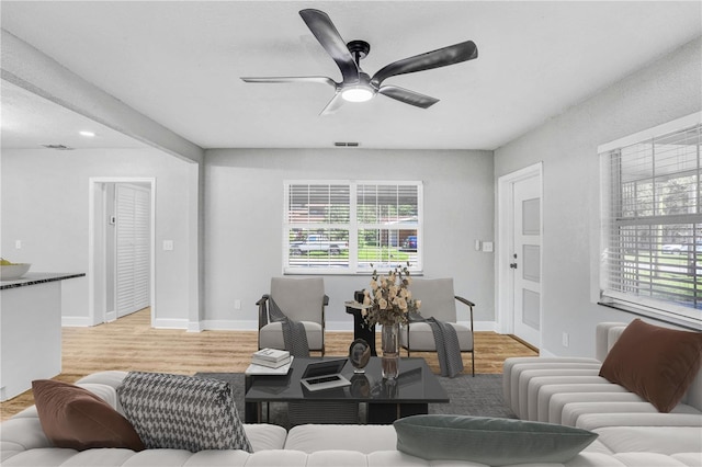 223 Pinehurst Dr, Auburndale, FL 33823 - living room with a ceiling fan and light wood finished floors