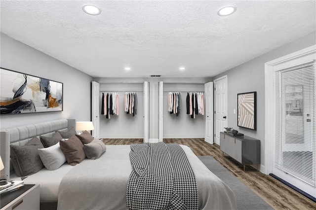223 Pinehurst Dr, Auburndale, FL 33823 - bedroom with wood finished floors, recessed lighting, and a textured ceiling