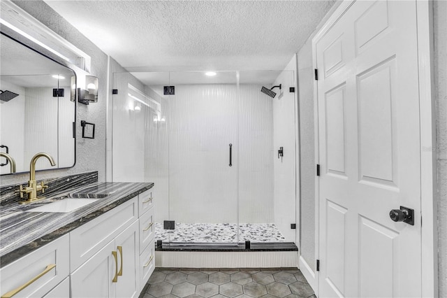 223 Pinehurst Dr, Auburndale, FL 33823 - bathroom with a stall shower, vanity, a textured ceiling, and tile patterned flooring