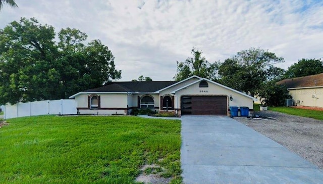 9642 Elgin Blvd, Spring Hill, FL 34606 - ranch-style home featuring concrete driveway and an attached garage