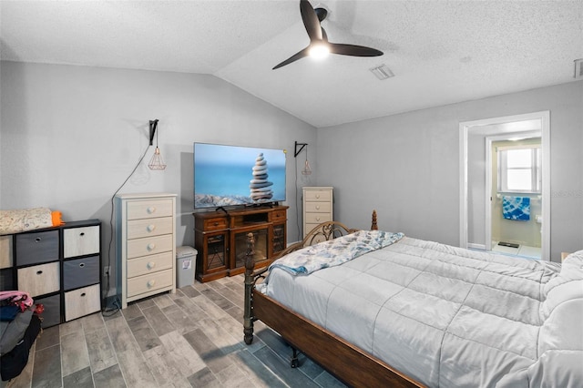 9642 Elgin Blvd, Spring Hill, FL 34606 - bedroom featuring wood finish floors, vaulted ceiling, ceiling fan, and a textured ceiling