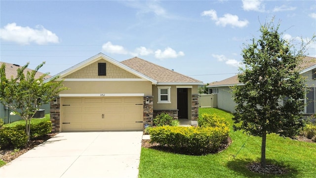 3762 Mossy Limb Ct, Palmetto, FL 34221 - craftsman inspired home with stucco siding, concrete driveway, stone siding, an attached garage, and a front yard
