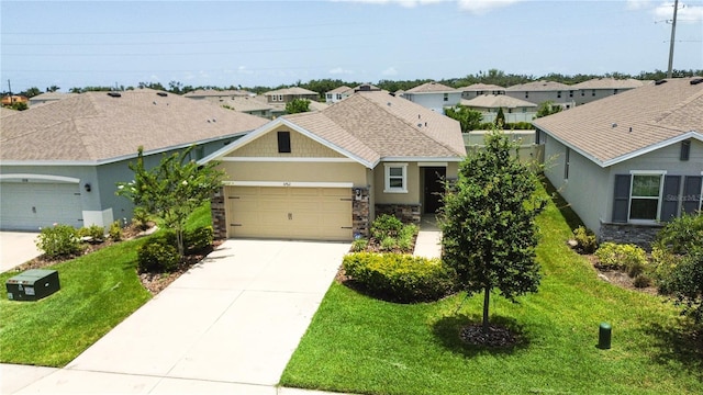 3762 Mossy Limb Ct, Palmetto, FL 34221 - view of front of home featuring stone siding, a residential view, a garage, and concrete driveway