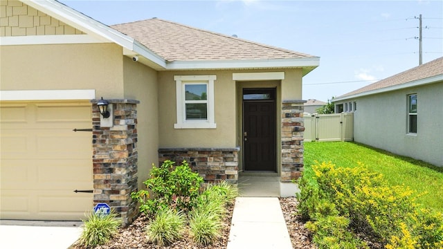 3762 Mossy Limb Ct, Palmetto, FL 34221 - doorway to property with stone siding, a shingled roof, a gate, and stucco siding