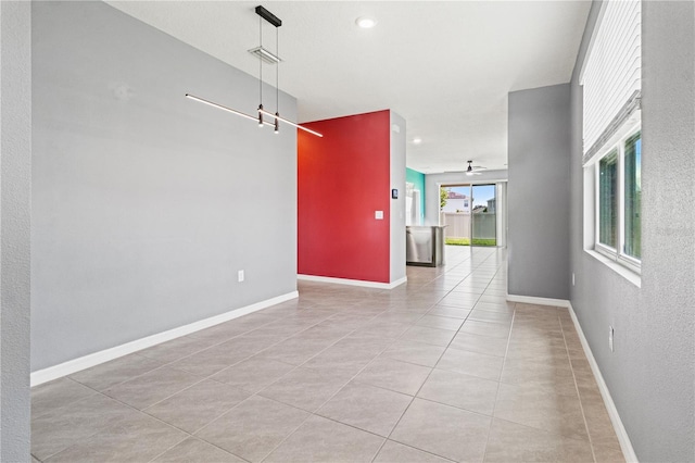 3762 Mossy Limb Ct, Palmetto, FL 34221 - tiled empty room with healthy amount of natural light, a ceiling fan, and a barn door