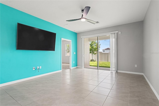 3762 Mossy Limb Ct, Palmetto, FL 34221 - empty room with a ceiling fan and light tile patterned floors