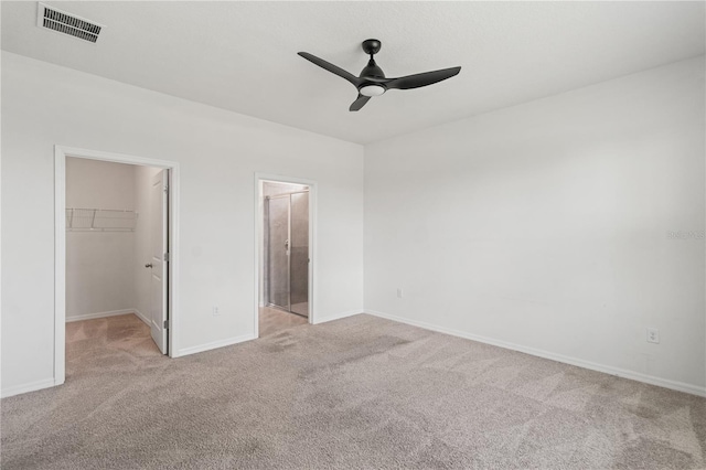3762 Mossy Limb Ct, Palmetto, FL 34221 - unfurnished bedroom featuring carpet flooring, a spacious closet, a closet, ceiling fan, and ensuite bath
