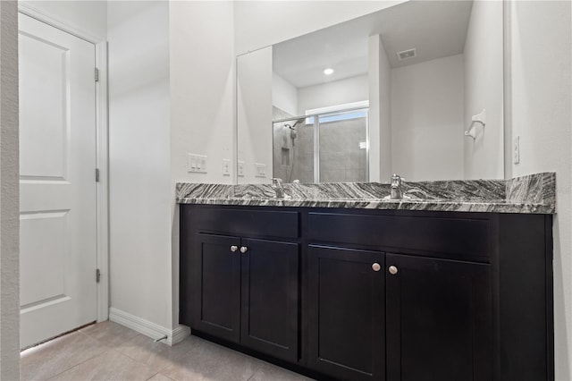3762 Mossy Limb Ct, Palmetto, FL 34221 - bathroom featuring a stall shower, double vanity, and tile patterned flooring