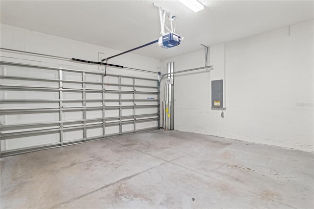 3762 Mossy Limb Ct, Palmetto, FL 34221 - garage with a garage door opener, electric panel, and concrete block wall