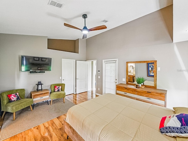 1338 Winding Willow Dr, Trinity, FL 34655 - bedroom with wood finished floors, ceiling fan, and high vaulted ceiling