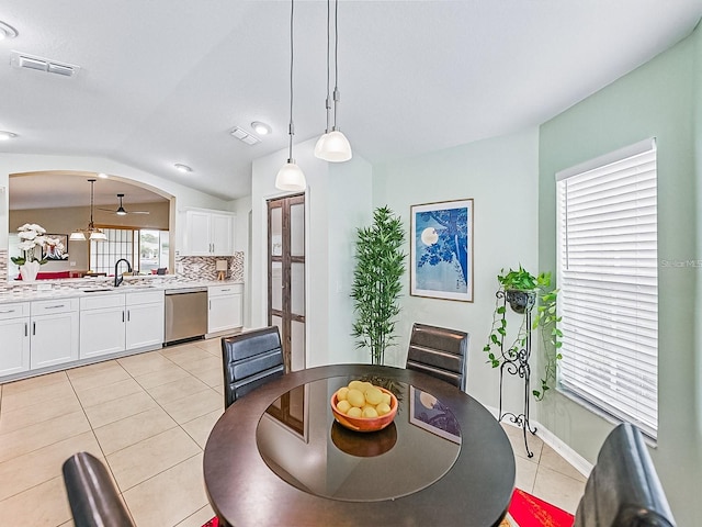1338 Winding Willow Dr, Trinity, FL 34655 - dining area with light tile patterned floors, french doors, and vaulted ceiling