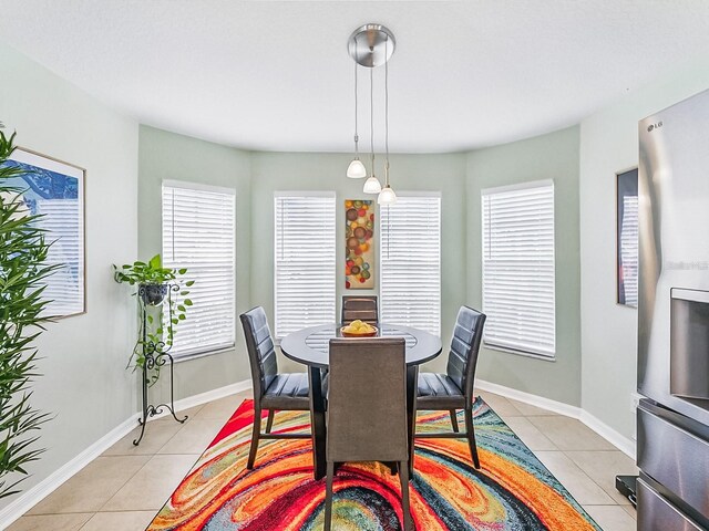 1338 Winding Willow Dr, Trinity, FL 34655 - dining space with light tile patterned floors and plenty of natural light