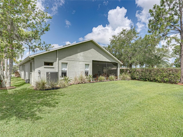 1338 Winding Willow Dr, Trinity, FL 34655 - back of house with a lawn and stucco siding