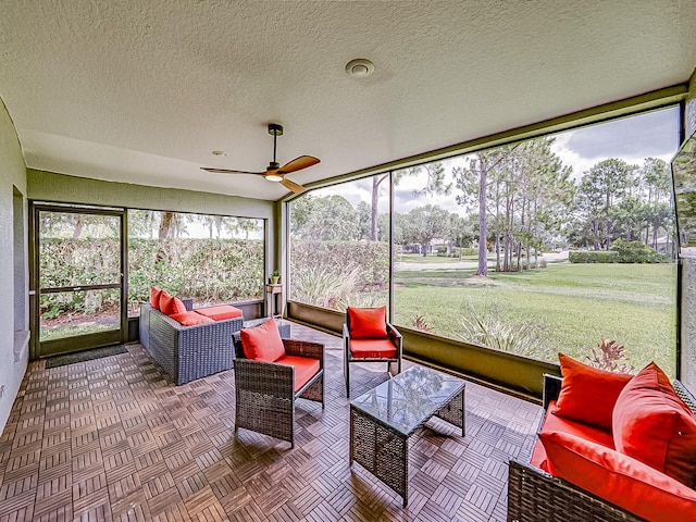 1338 Winding Willow Dr, Trinity, FL 34655 - sunroom featuring an outdoor living space, ceiling fan, and a textured ceiling