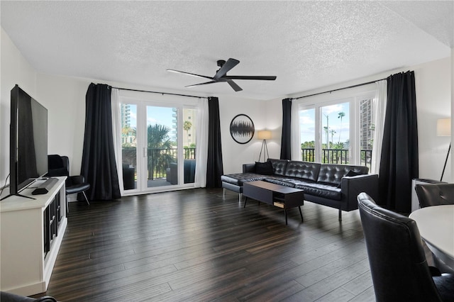 1501 Gulf Blvd Unit 201, Clearwater Beach, FL 33767 - living room featuring a textured ceiling, dark wood-style flooring, and a ceiling fan