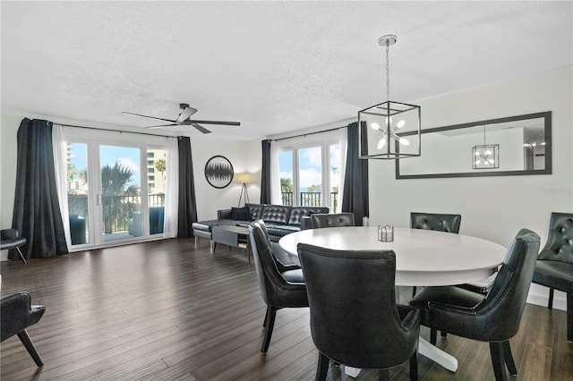 1501 Gulf Blvd Unit 201, Clearwater Beach, FL 33767 - dining space with a chandelier, healthy amount of natural light, dark wood finished floors, a textured ceiling, and a ceiling fan