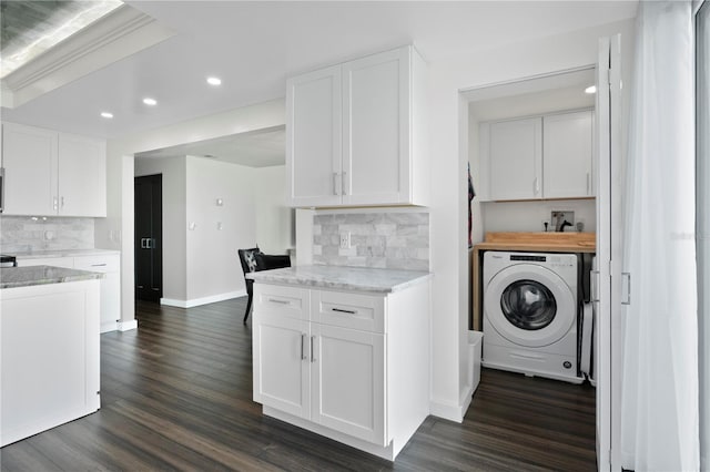 1501 Gulf Blvd Unit 201, Clearwater Beach, FL 33767 - washroom with washer / clothes dryer, recessed lighting, dark wood-type flooring, and cabinet space