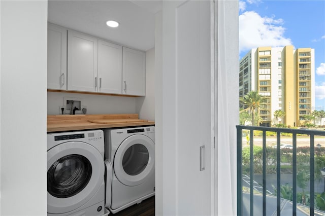 1501 Gulf Blvd Unit 201, Clearwater Beach, FL 33767 - laundry room with washing machine and dryer, cabinet space, and recessed lighting