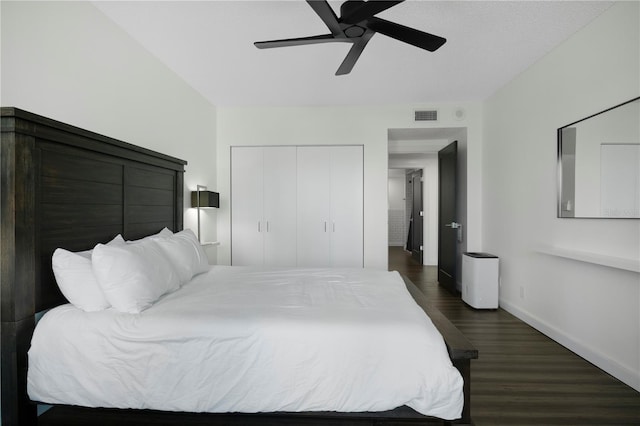 1501 Gulf Blvd Unit 201, Clearwater Beach, FL 33767 - bedroom with dark wood-type flooring, a closet, and a ceiling fan