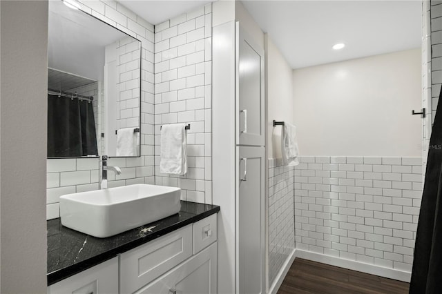 1501 Gulf Blvd Unit 201, Clearwater Beach, FL 33767 - bathroom with vanity, wood finished floors, decorative backsplash, and recessed lighting