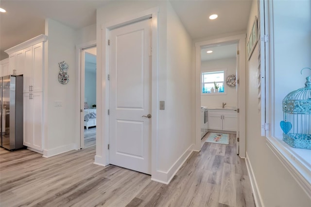 803 Oak Bend Ln, Dunedin, FL 34698 - hallway featuring light wood finished floors and recessed lighting