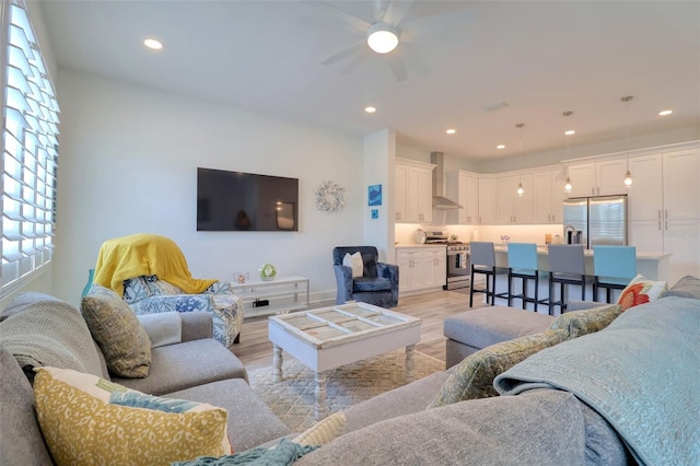 803 Oak Bend Ln, Dunedin, FL 34698 - living area featuring light wood-type flooring, a ceiling fan, healthy amount of natural light, and recessed lighting