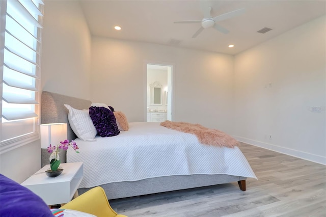 803 Oak Bend Ln, Dunedin, FL 34698 - bedroom with wood finished floors, connected bathroom, recessed lighting, and ceiling fan