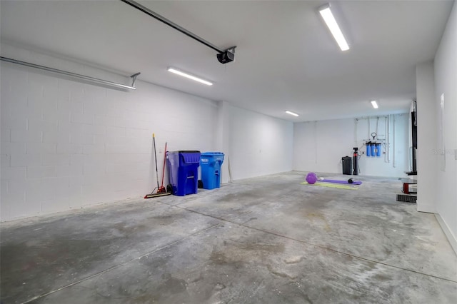 803 Oak Bend Ln, Dunedin, FL 34698 - garage with a garage door opener and concrete block wall
