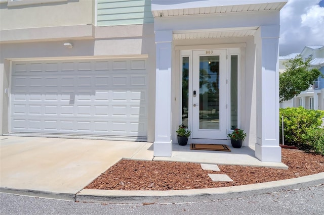 803 Oak Bend Ln, Dunedin, FL 34698 - property entrance featuring concrete driveway and an attached garage