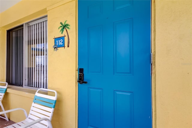 282 Treasure Island Cswy Unit 12, Treasure Island, FL 33706 - property entrance with stucco siding