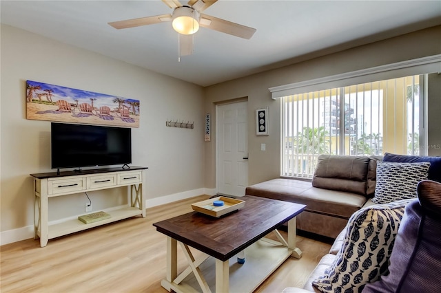 282 Treasure Island Cswy Unit 12, Treasure Island, FL 33706 - living room with light wood-style floors and a ceiling fan