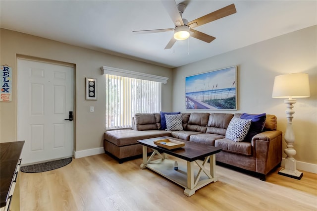 282 Treasure Island Cswy Unit 12, Treasure Island, FL 33706 - living room featuring light wood-style flooring and ceiling fan