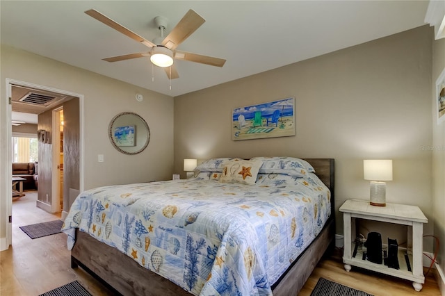 282 Treasure Island Cswy Unit 12, Treasure Island, FL 33706 - bedroom with wood finished floors and a ceiling fan
