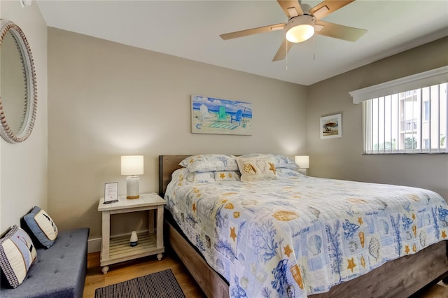 282 Treasure Island Cswy Unit 12, Treasure Island, FL 33706 - bedroom featuring wood finished floors and ceiling fan