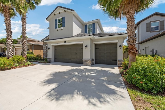 3532 Wicket Field Rd, Lutz, FL 33548 - traditional-style home with stucco siding, stone siding, driveway, a garage, and a tiled roof
