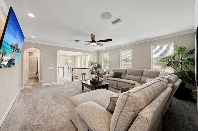 3532 Wicket Field Rd, Lutz, FL 33548 - living area featuring ceiling fan, light carpet, arched walkways, crown molding, and recessed lighting