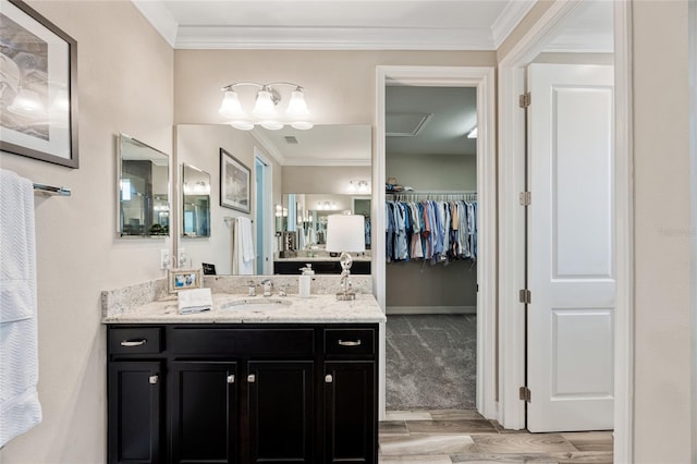 3532 Wicket Field Rd, Lutz, FL 33548 - bathroom with vanity, a spacious closet, wood finished floors, and crown molding