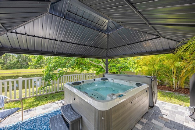 3532 Wicket Field Rd, Lutz, FL 33548 - view of patio / terrace featuring a hot tub and a water view