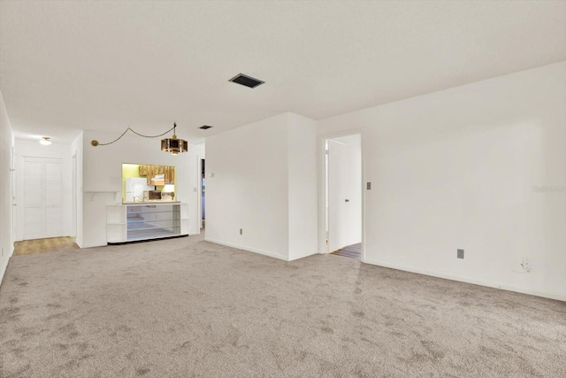 1206 10th Cir SE, Largo, FL 33771 - empty room with light carpet