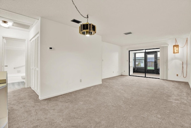 1206 10th Cir SE, Largo, FL 33771 - spare room featuring carpet flooring