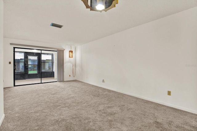 1206 10th Cir SE, Largo, FL 33771 - carpeted spare room featuring baseboards