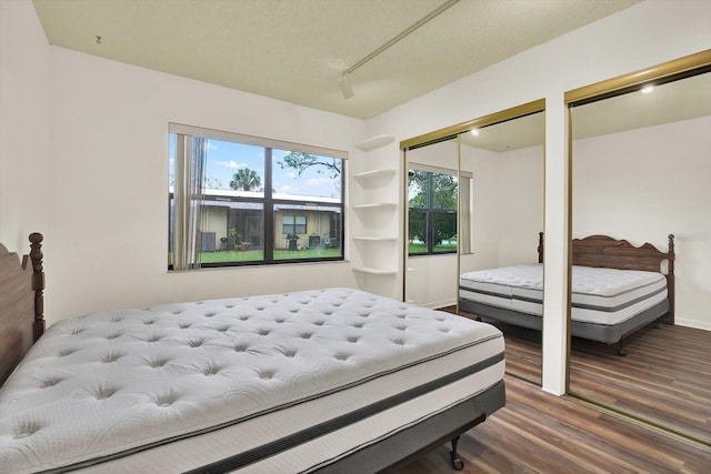 1206 10th Cir SE, Largo, FL 33771 - bedroom with wood finished floors and two closets