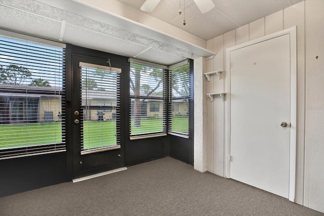 1206 10th Cir SE, Largo, FL 33771 - unfurnished room featuring carpet, a ceiling fan, and french doors