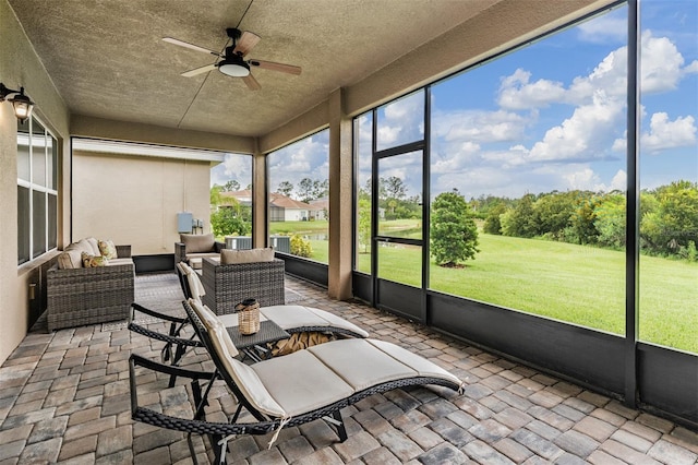 3197 Acacia Bay Ave, Wesley Chapel, FL 33543 - sunroom / solarium featuring a ceiling fan and outdoor lounge area