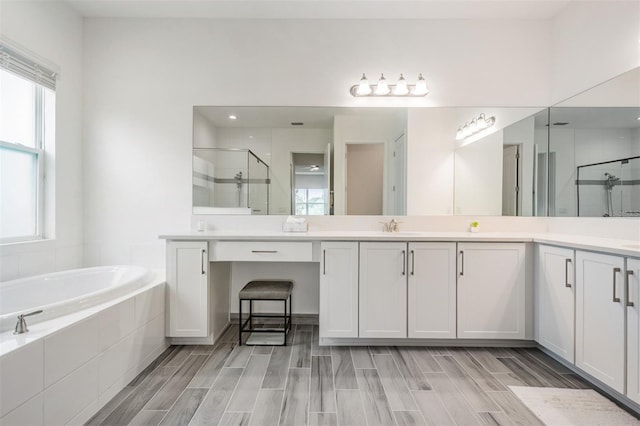3197 Acacia Bay Ave, Wesley Chapel, FL 33543 - bathroom featuring a shower stall, double vanity, and a bath