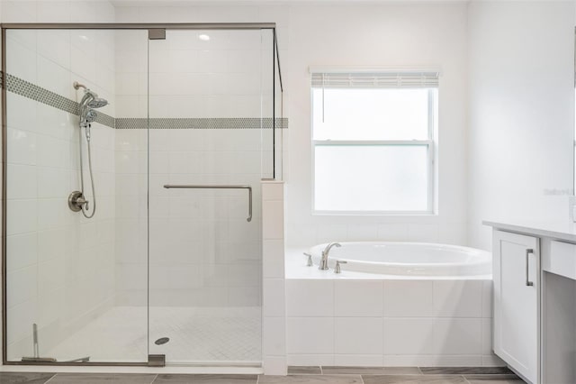 3197 Acacia Bay Ave, Wesley Chapel, FL 33543 - bathroom featuring a bath, a shower stall, and vanity