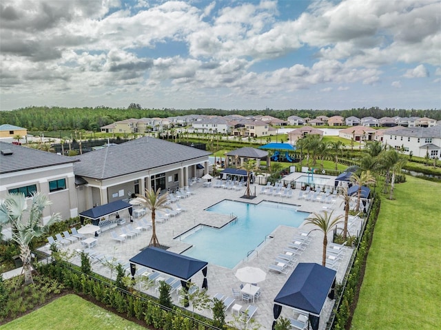 3197 Acacia Bay Ave, Wesley Chapel, FL 33543 - community pool with a residential view and a patio
